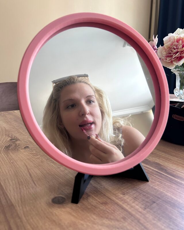 Mirrorloom infinity mirror styled as a vanity mirror on a wooden desk